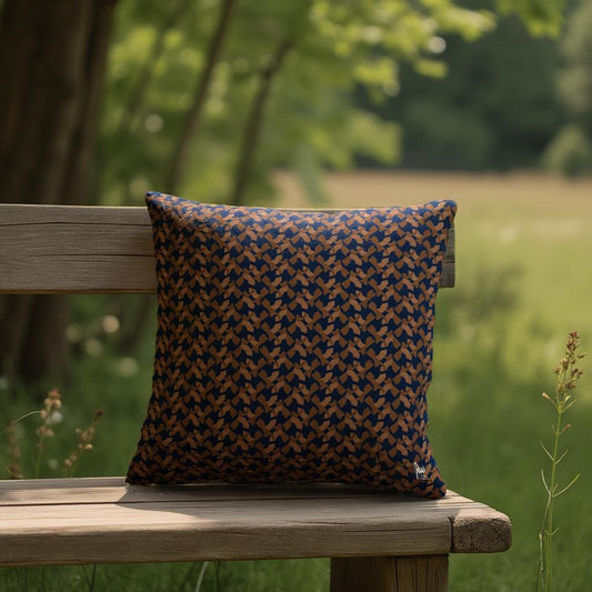 Patterned pillow on a wooden bench with a natural background