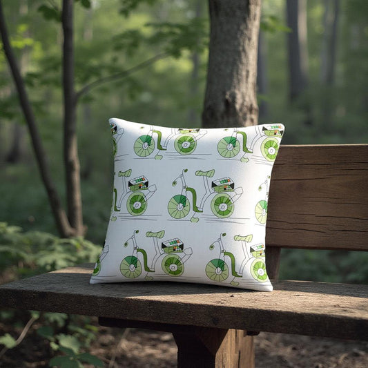 Pillow with green bicycle pattern on a wooden bench in a forest setting
