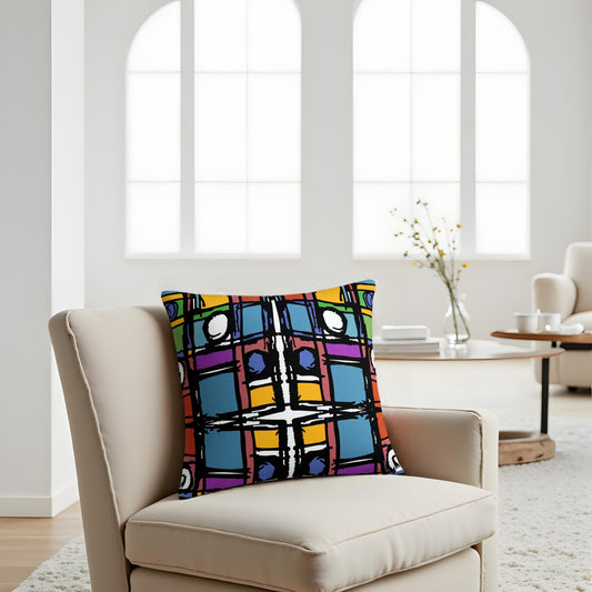 Colorful patterned pillow on a beige armchair in a bright living room.