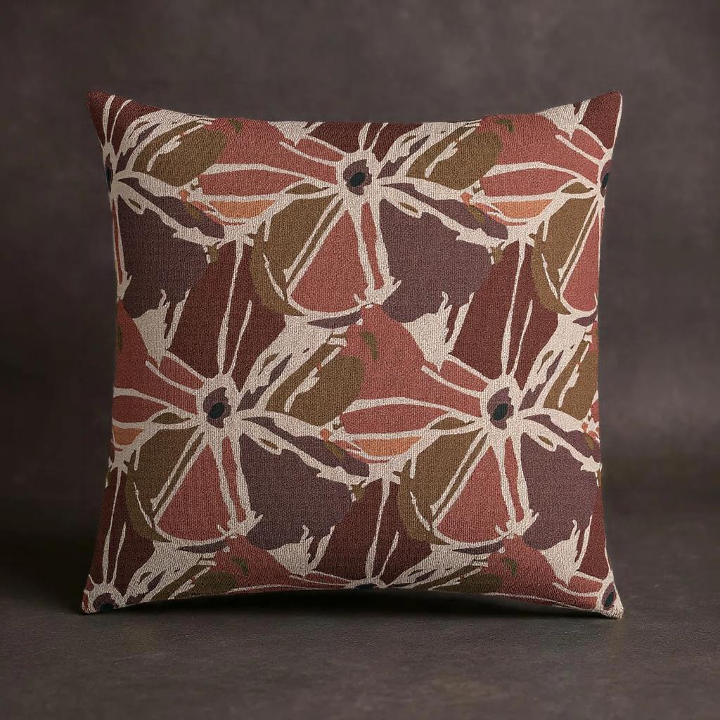 Decorative pillow with a floral pattern on a dark background