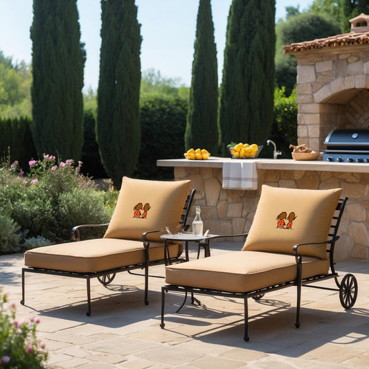 Two beige lounge chairs with decorative pillows on a patio with outdoor furniture and plants.