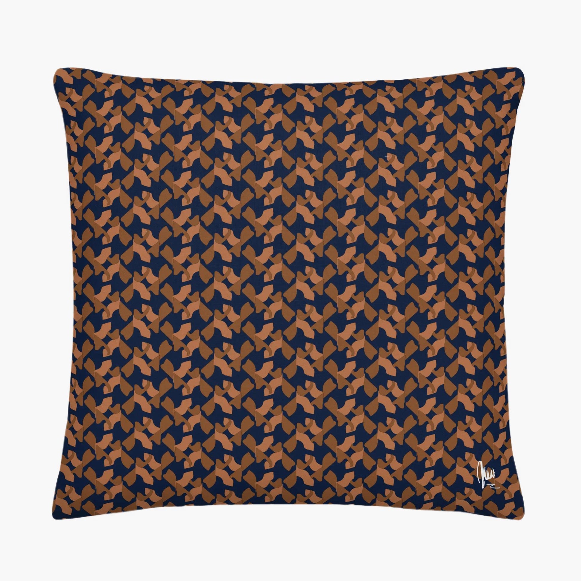 Patterned pillow with blue and brown design on a white background