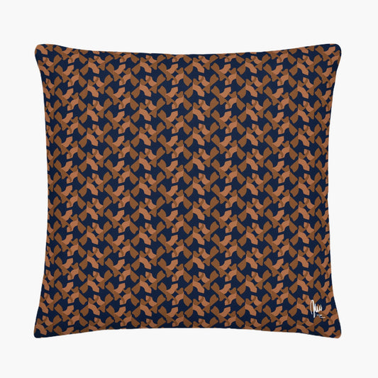 Patterned pillow with blue and brown design on a white background