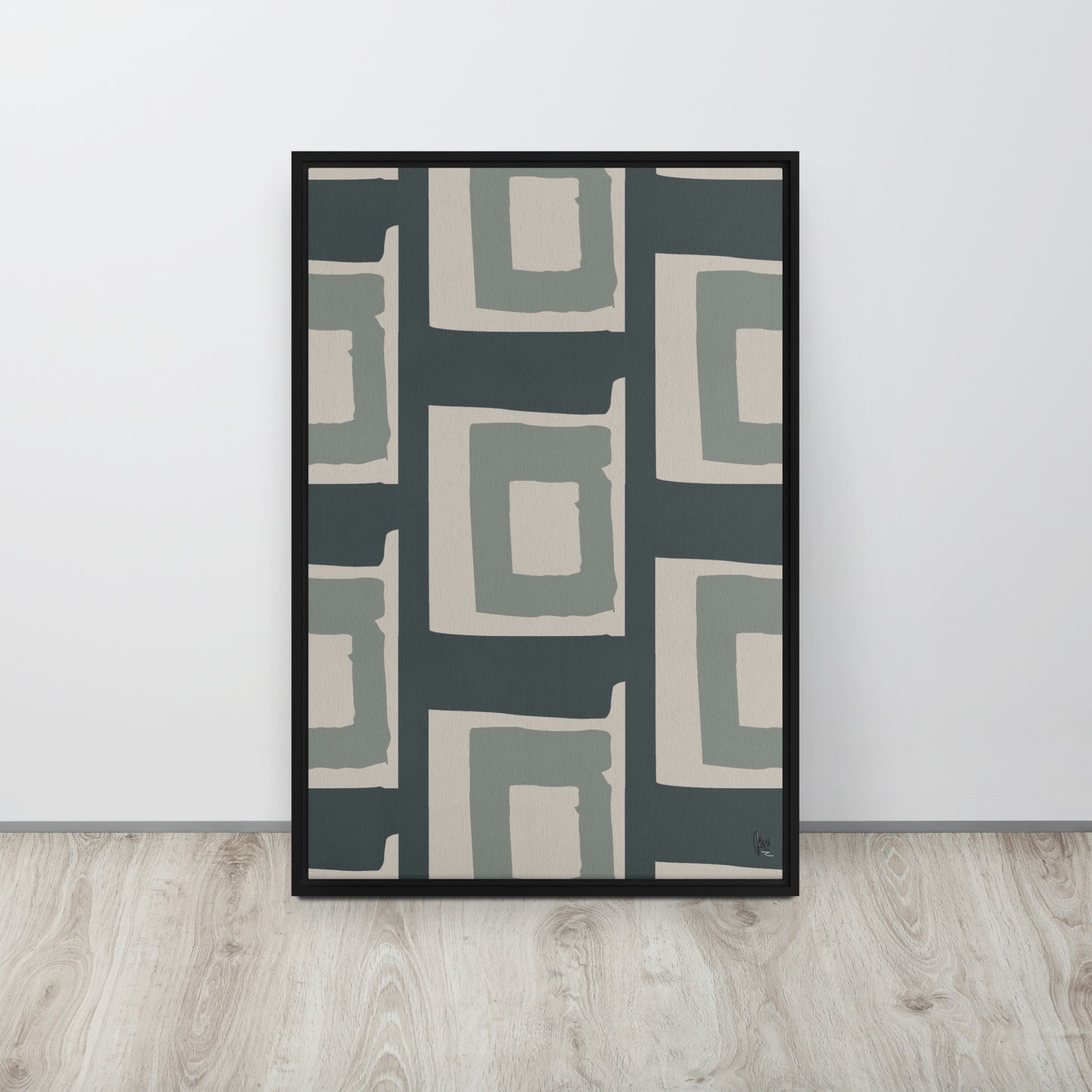 Framed abstract art print with geometric pattern on a white wall.