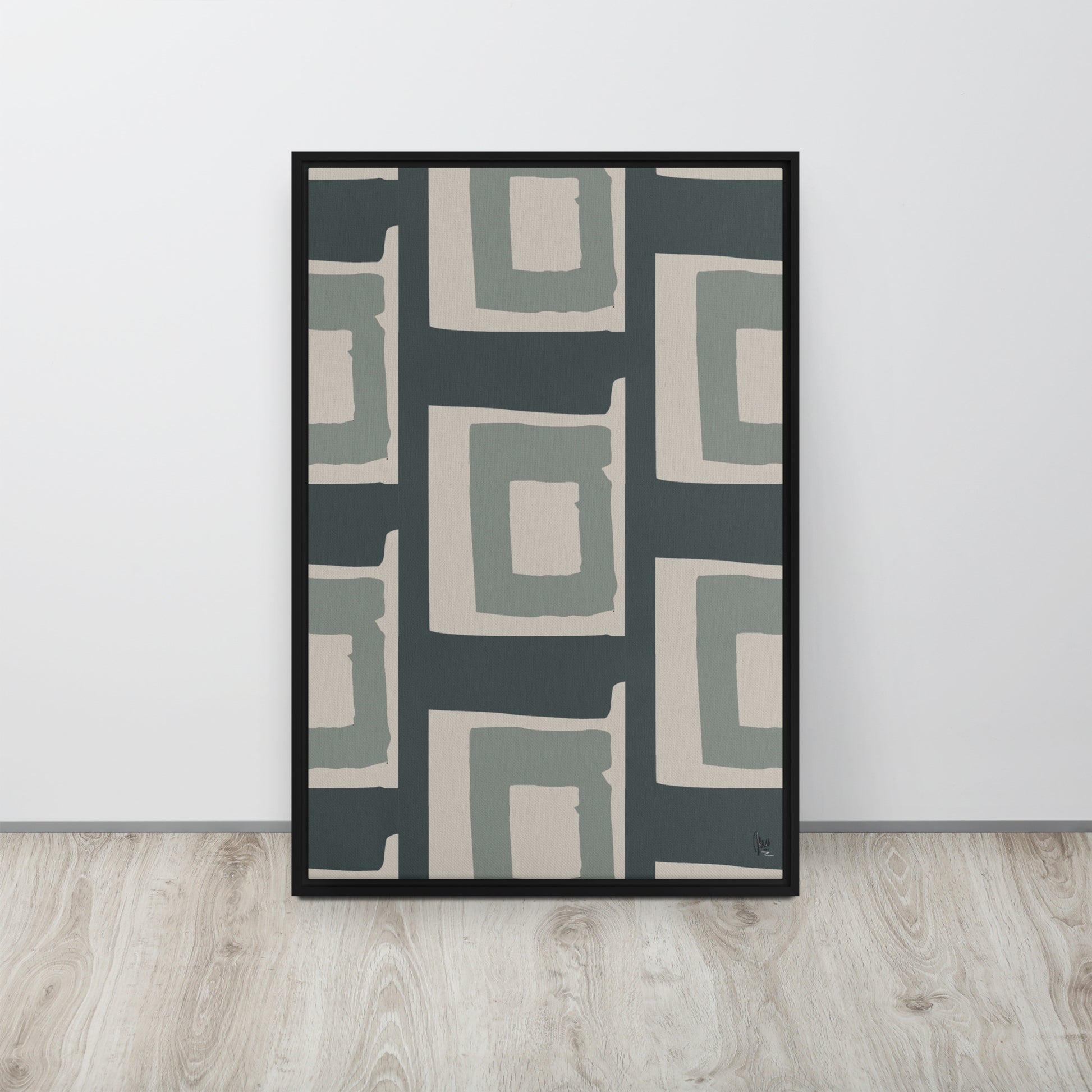 Framed abstract art print with geometric pattern on a white wall.