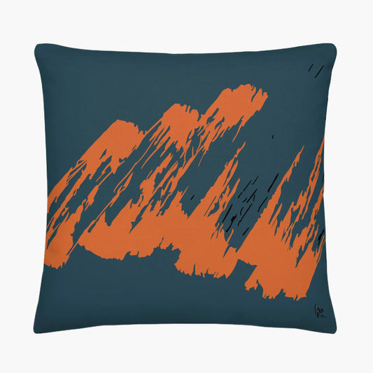 Decorative pillow with orange abstract design on a dark blue background