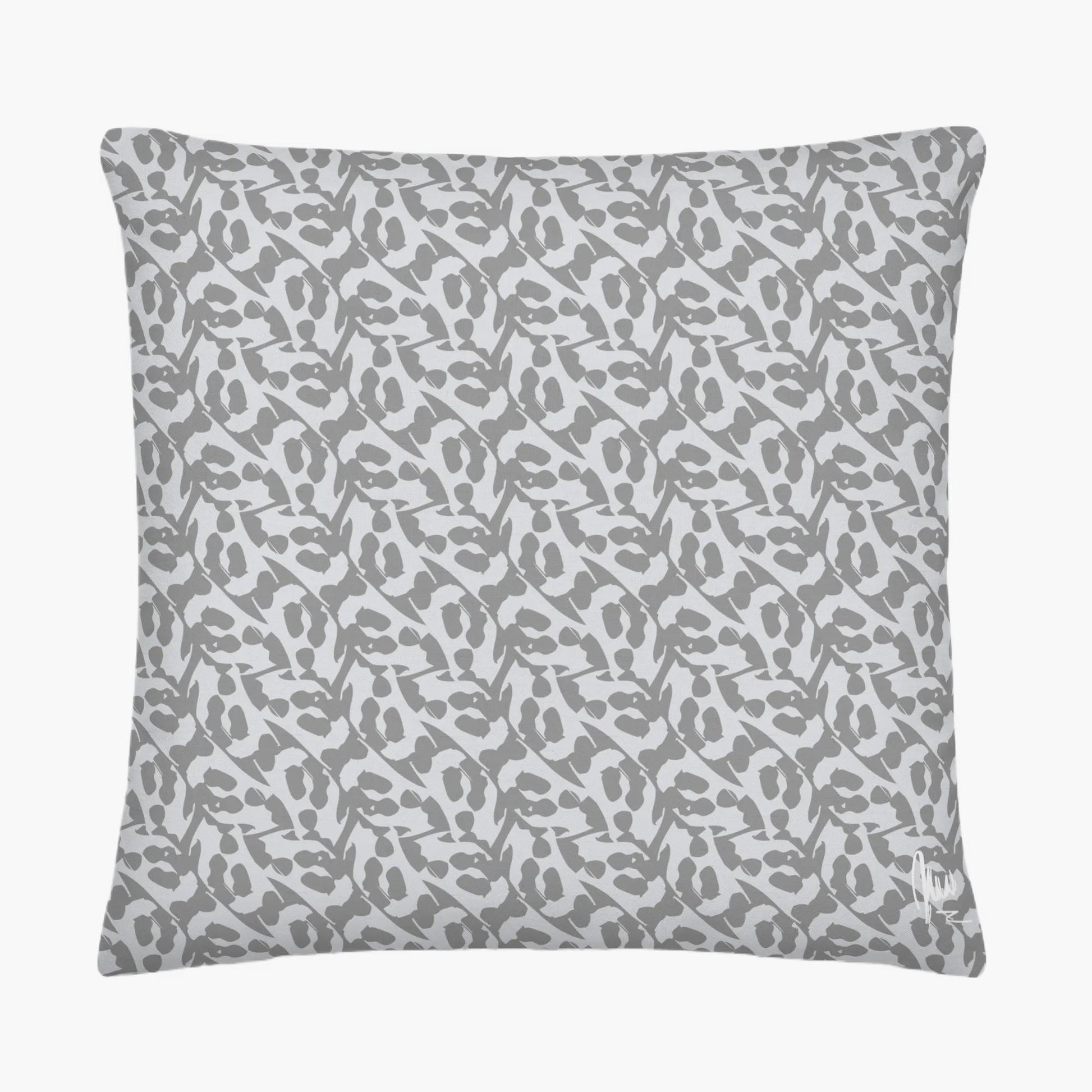 Gray pillow with subtle pattern on a white background