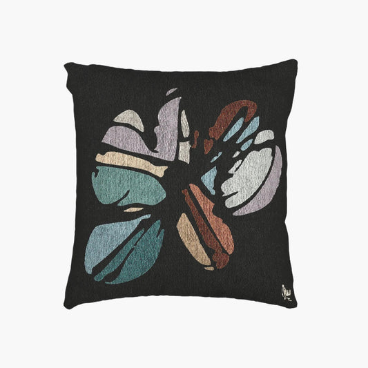 Decorative pillow with a butterfly design on a black background
