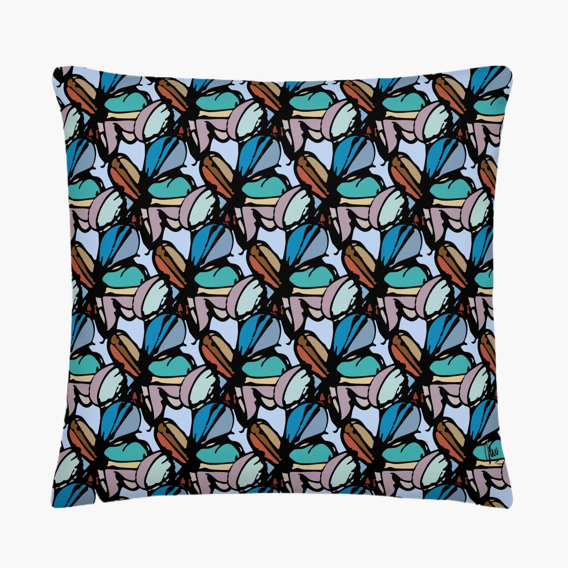 Pillow with a pattern of blue and brown shapes on a white background