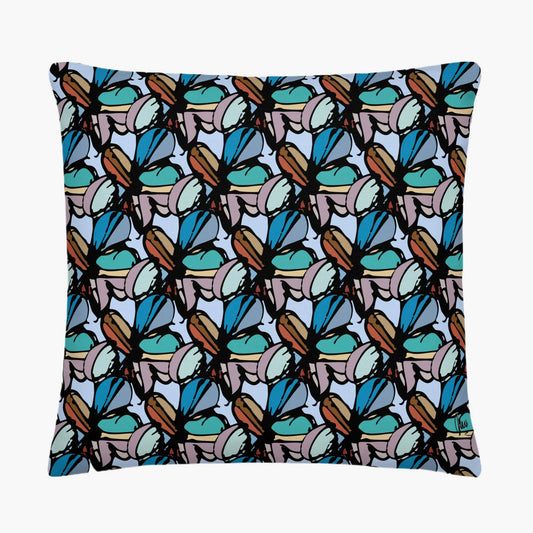 Pillow with a pattern of blue and brown shapes on a white background