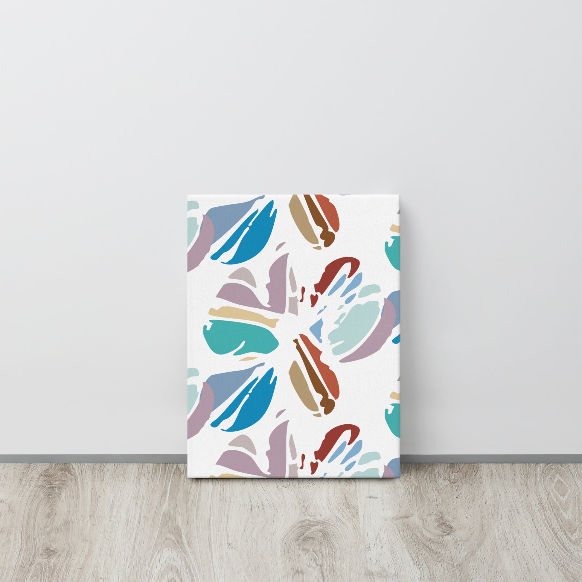 Colorful abstract patterned poster on a white wall with wooden floor.