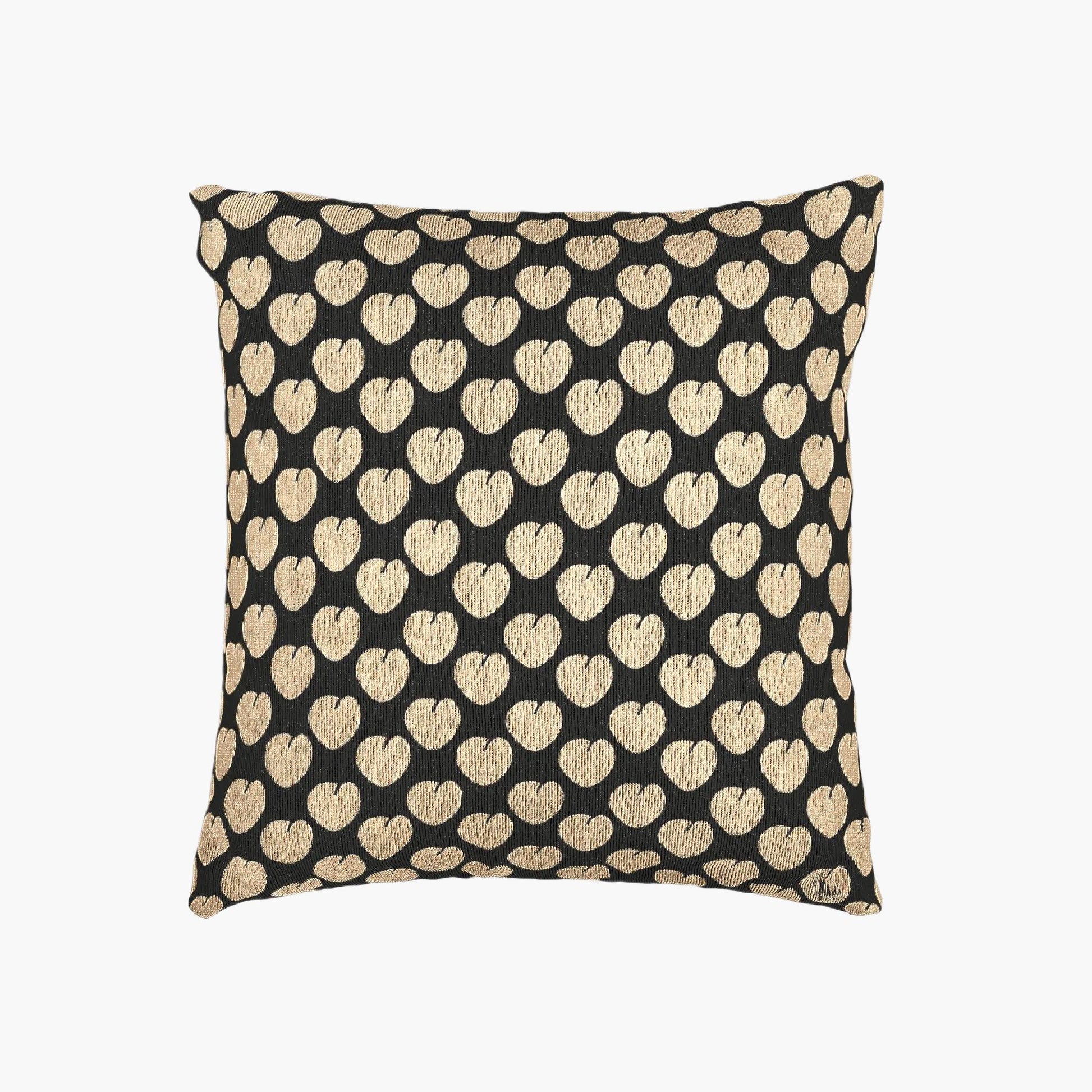 Decorative pillow with gold heart pattern on a black background